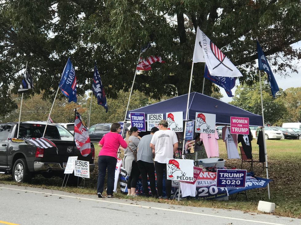 Trump memorabilia vendors set up hours before the Pence event