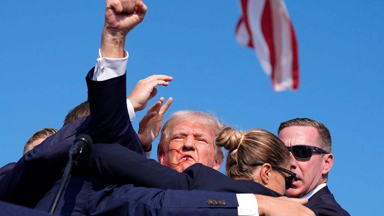 Trump rushed off stage