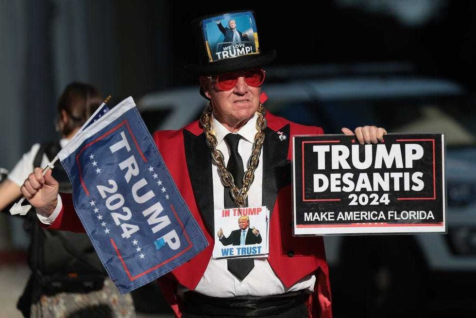 Trump supporter Gregg Donvan stands outside the the Wilkie D. Ferguson Jr. United States Federal Courthouse.