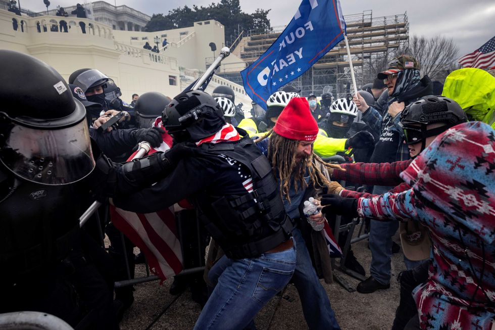 Trump supporters clash with police and security forces as people try to storm the US Capitol on January 6, 2021 in Washington, DC.