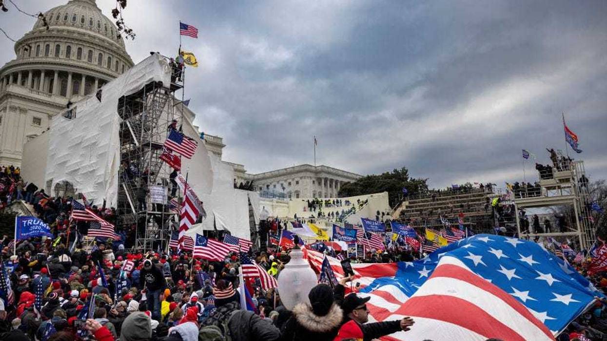 Trump supporters clash with police and security forces as people try to storm the US Capitol on January 6, 2021 in Washington, DC. Demonstrators breeched security and entered the Capitol as Congress debated the 2020 presidential election Electoral Vote Certification. (photo by Brent Stirton/Getty Images)