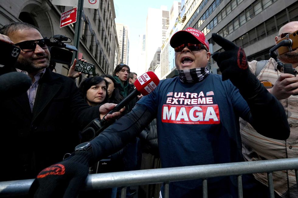 Trump supporters speak out in front of the press outside Trump Tower in New York, NY, on April 3, 2023.