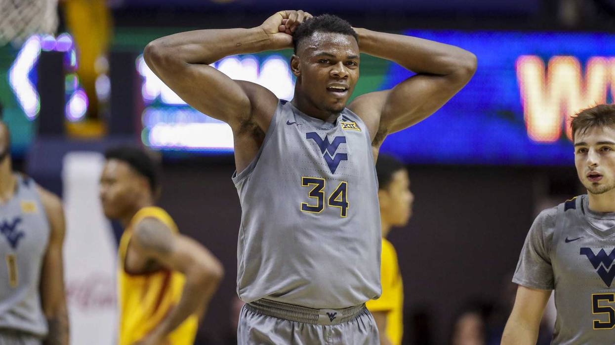 Tshiebwe West Virgina forward with arms over head