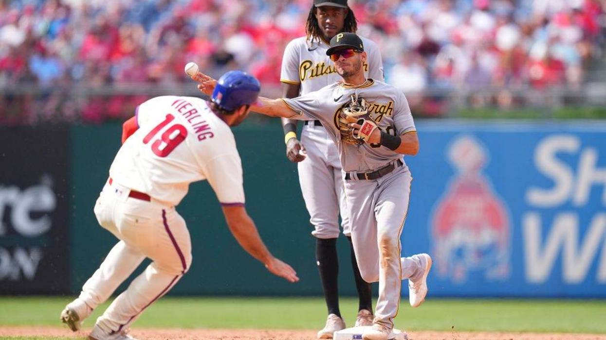 Tucupita Marcano, #30 of the Pittsburgh Pirates, turns a double play against Matt Vierling, #19 of the Philadelphia Phillies, in the bottom of the seventh inning at Citizens Bank Park on Aug. 28, 2022, in Philadelphia, Pennsylvania. The Pirates defeated the Phillies 5-0.