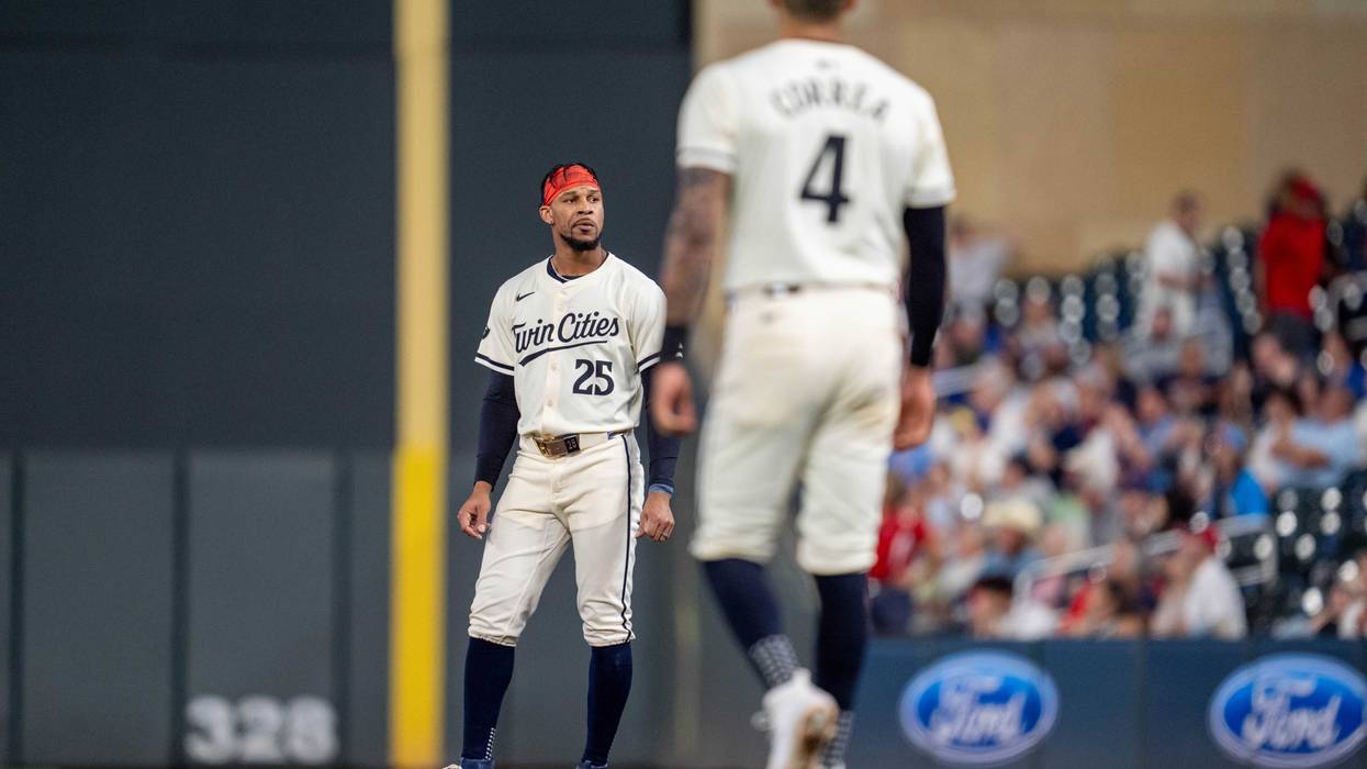 Twins outfielder Byron Buxton (25) is stranded on base after Minnesota Twins shortstop Carlos Correa (4) strikes out to end the seventh inning against the Miami Marlins at Target Field.
