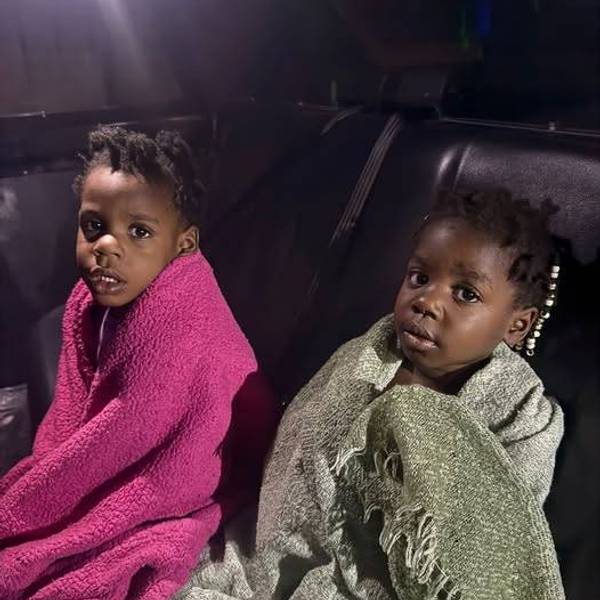 Two children inside a Taylor Police car after they were found alone outside
