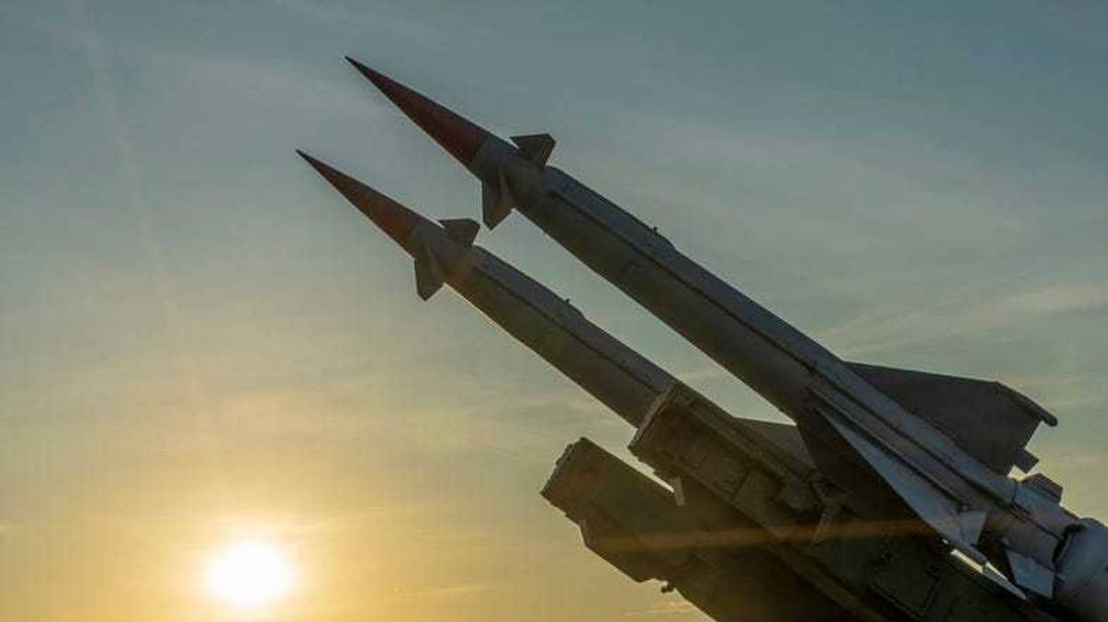 Two combat missiles aimed at the sky.