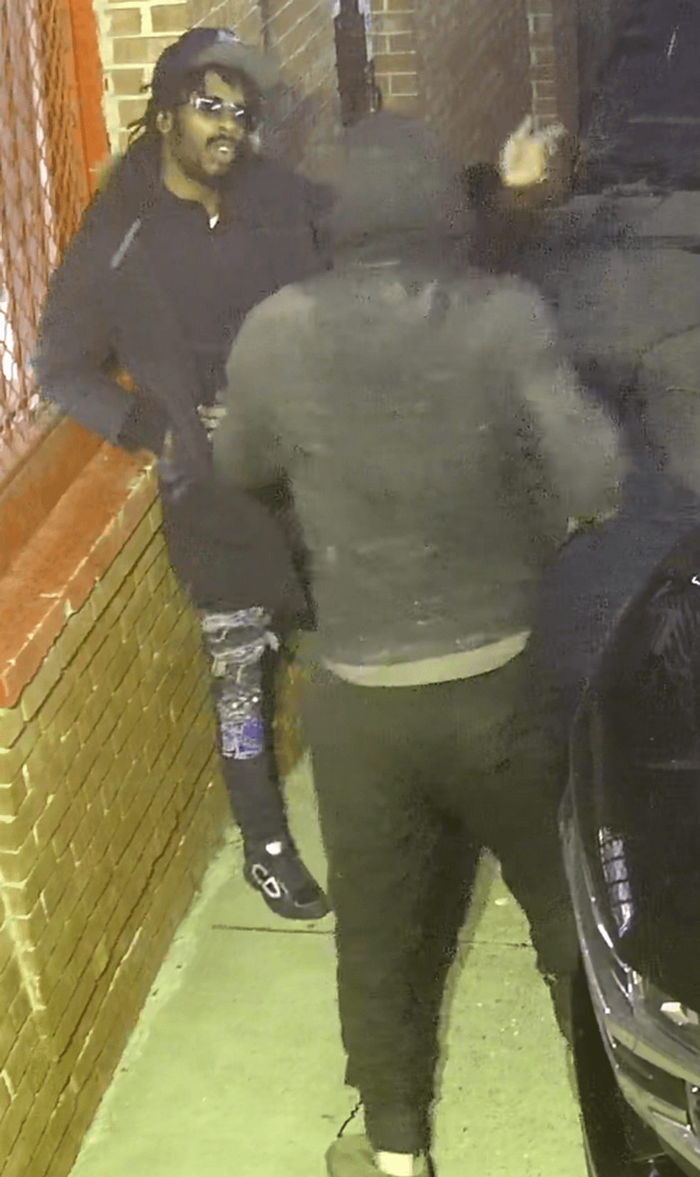 Two men arguing on security camera