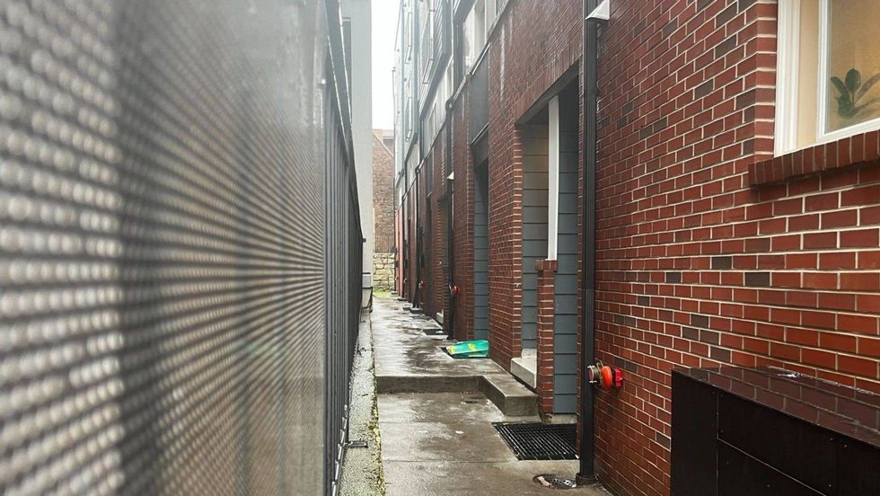 Two men, armed with guns, illegally entered an apartment at this property and robbed 11 people living there.