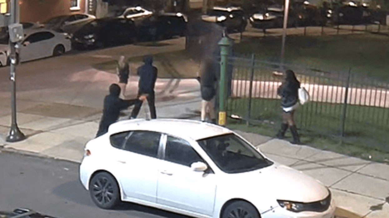 Two men seen on security camera footage robbing people at gunpoint just off Temple's campus on N 16th Street on Oct. 4, 2026.