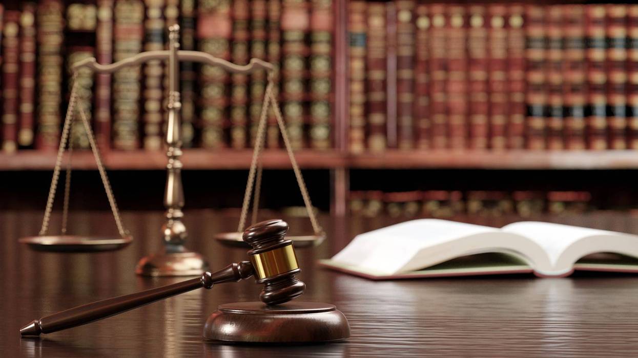 Two men were charged Friday with conning thousands of investors into purchasing a cryptocurrency that purportedly provided exclusive access to a trading program that they falsely claimed was profitable, and then using most of the $1.8 million raised to enrich themselves. (Photo by Getty Images)