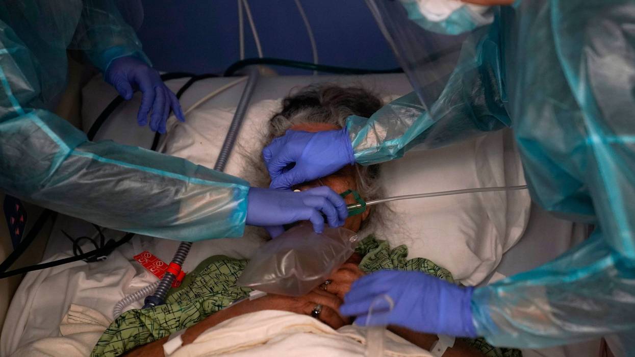 Two nurses put a ventilator on a patient in a COVID-19 unit at St. Joseph Hospital in Orange, Calif. Thursday, Jan. 7, 2021. California's COVID-19 emergency declaration ends on Tuesday, Feb. 28, 2023. Gov. Gavin Newsom first issued the emergency declaration on March 4, 2020. The emergency ends just as California officially passed 100,000 COVID-related deaths during the pandemic.