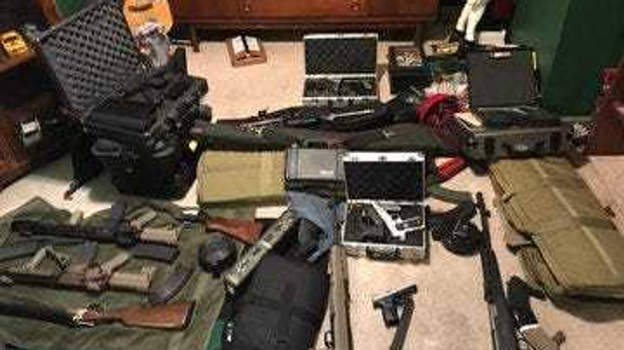 Two people are in custody Friday after police discovered a stash of guns at a home in Lawndale on the West Side.