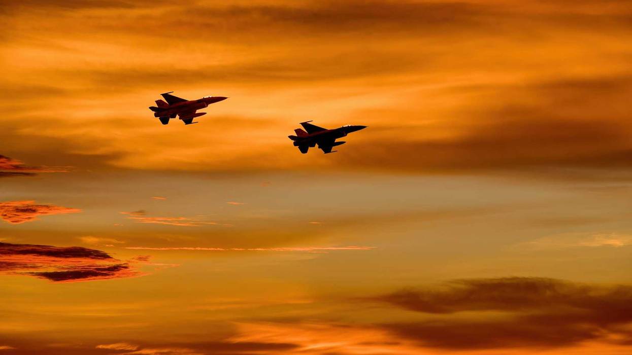 Two United States fighter jets in the sky.