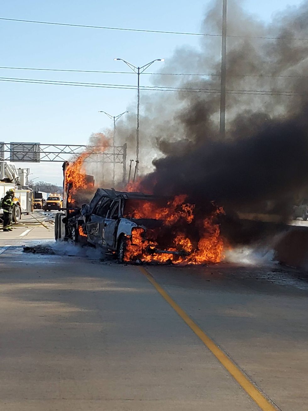 Two vehicles erupted in flames Thursday after a crash on the Regan Tollway near Naperville Road.