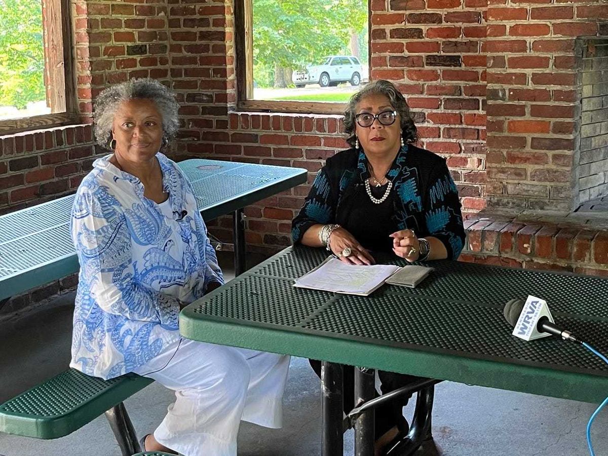 Two women at a picnic table
