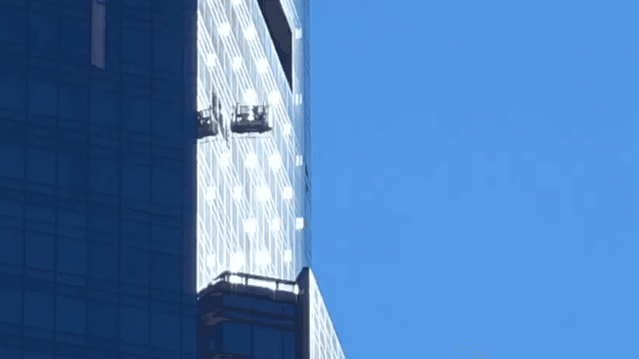 Two workers were stuck after their scaffolding was left swinging wildly outside a high-rise near Columbus Circle on Feb. 28, 2025.