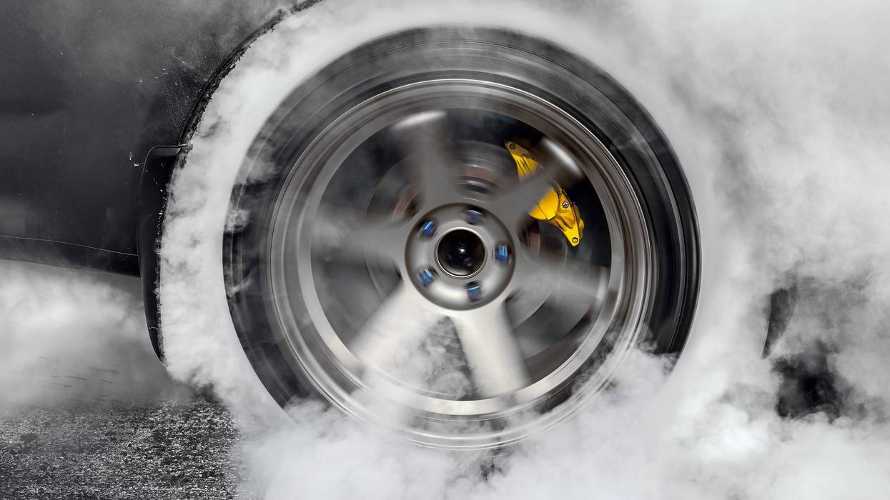 Two young men were charged with reckless driving that led to the death of a Macomb County man after he was ejected from a vehicle during an alleged drag race in Pontiac this spring.