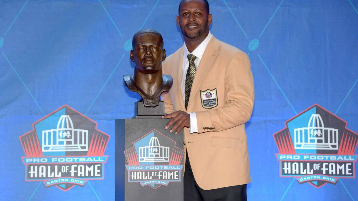 Ty Law poses with bust during the Pro Football Hall of Fame Enshrinement