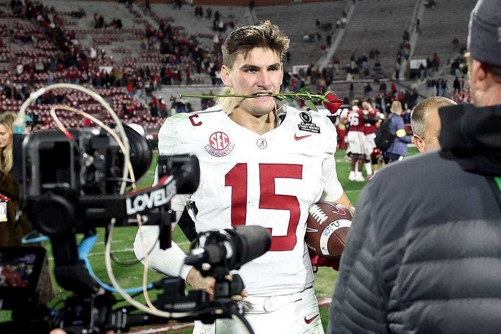 Ty Simpson #15 of the Alabama Crimson Tide celebrates after defeating the Oklahoma Sooners during 2025 College Football Playoff First Round Game at Gaylord Family Oklahoma Memorial Stadium on December 19, 2025 in Norman, Oklahoma.