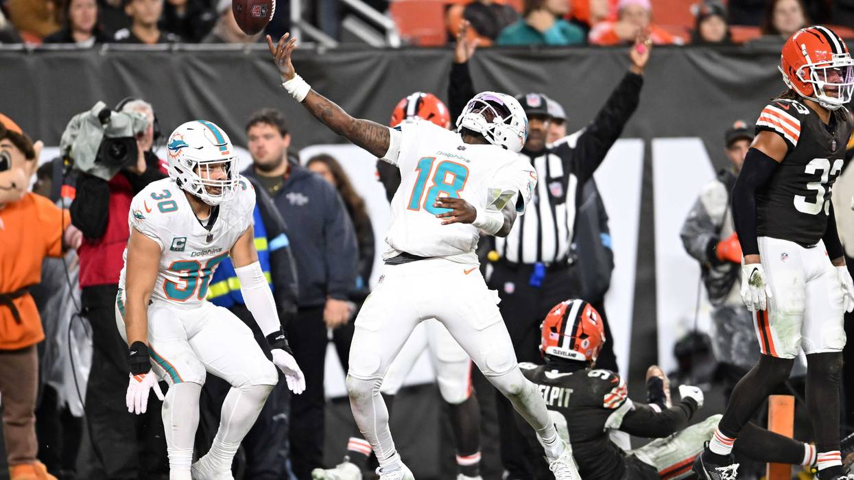 Tyler Huntley #18 of the Miami Dolphins celebrates a touchdown during the third quarter against the Cleveland Browns at Huntington Bank Field on December 29, 2024 in Cleveland, Ohio.