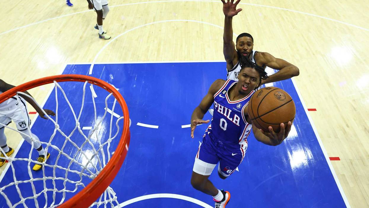Tyrese Maxey, #0 of the Philadelphia 76ers, goes up for a layup against Mikal Bridges, #1 of the Brooklyn Nets, in the first quarter during Game 2 of the Eastern Conference first-round playoffs at the Wells Fargo Center on April 17, 2023, in Philadelphia, Pennsylvania.