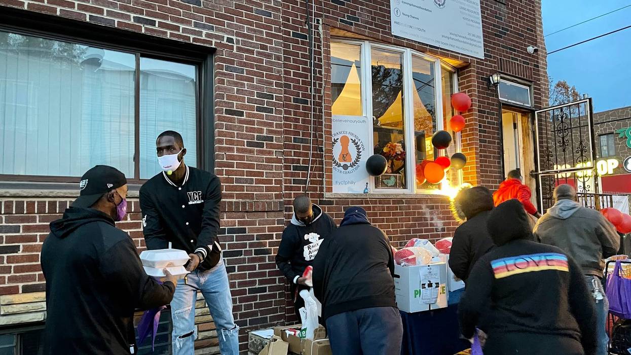 Tyrique Glasgow, who leads the Young Chances Foundation in Southwest Philadelphia, giving away free food in Grays Ferry.