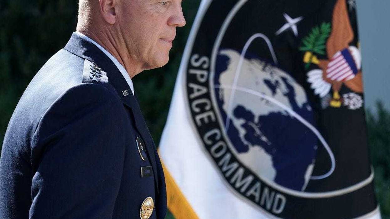 U.S. Air Force Space Command Gen. John "Jay" Raymond stands next to the flag of the newly established U.S. Space Command, the sixth national armed service, in the Rose Garden at the White House August 29, 2019 in Washington, DC.