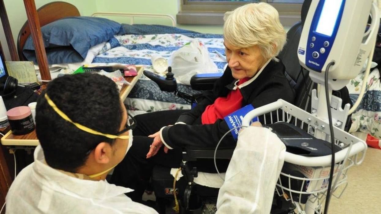 U.S. Army Spc. Jabari Ashanti, a Combat Medic with the 1st Battalion, 114th Infantry Regiment, New Jersey Army National Guard (NJARNG), checks a resident’s blood pressure at the New Jersey Veterans Memorial Home at Menlo Park in Edison, N.J., April 2020.
