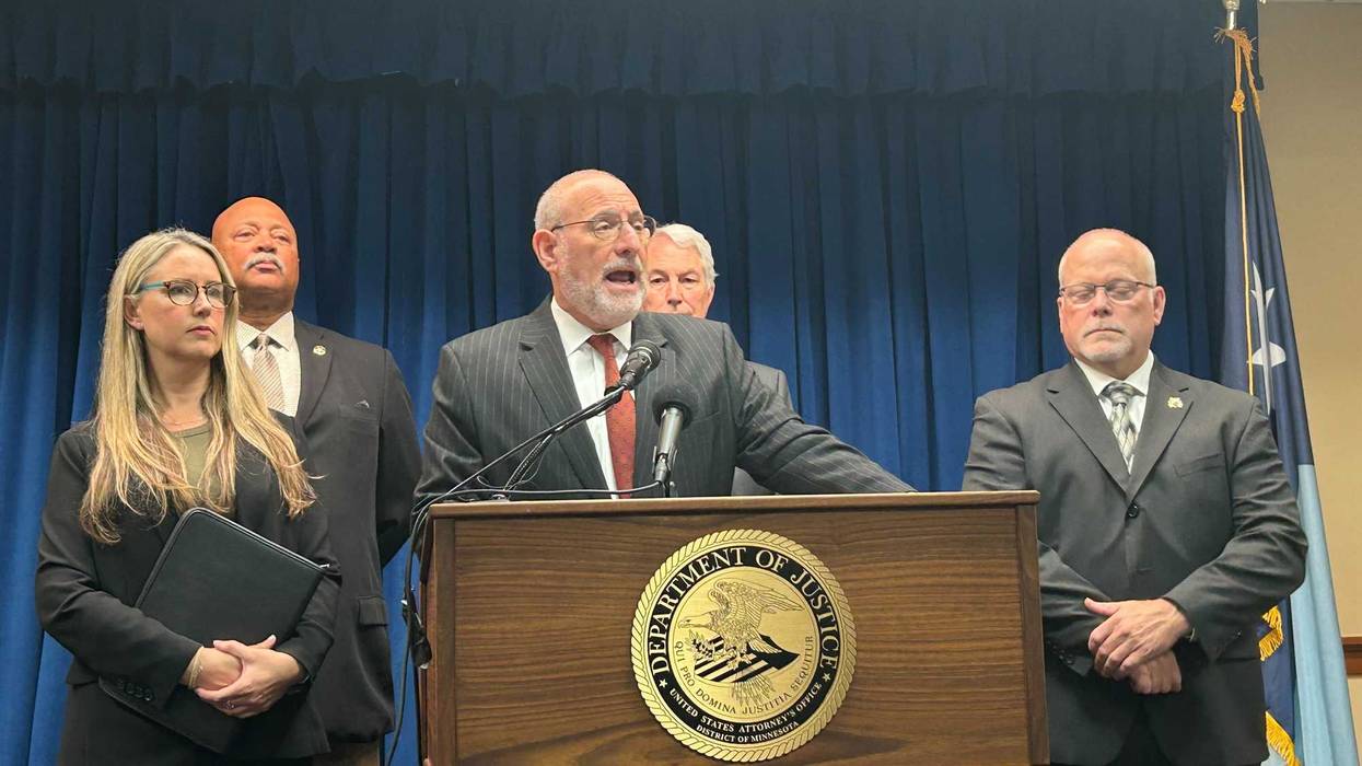 U.S. Attorney Andrew Luger (center) and other from the Department of Justice and DEA making the announcement Tuesday.