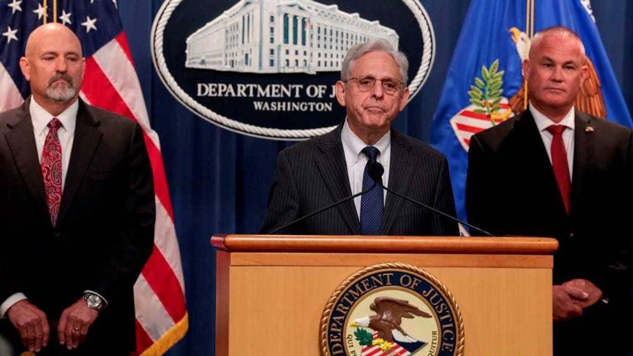U.S. Attorney General Merrick Garland (C) speaks at a press conference on June 13, 2022 in Washington, DC.
