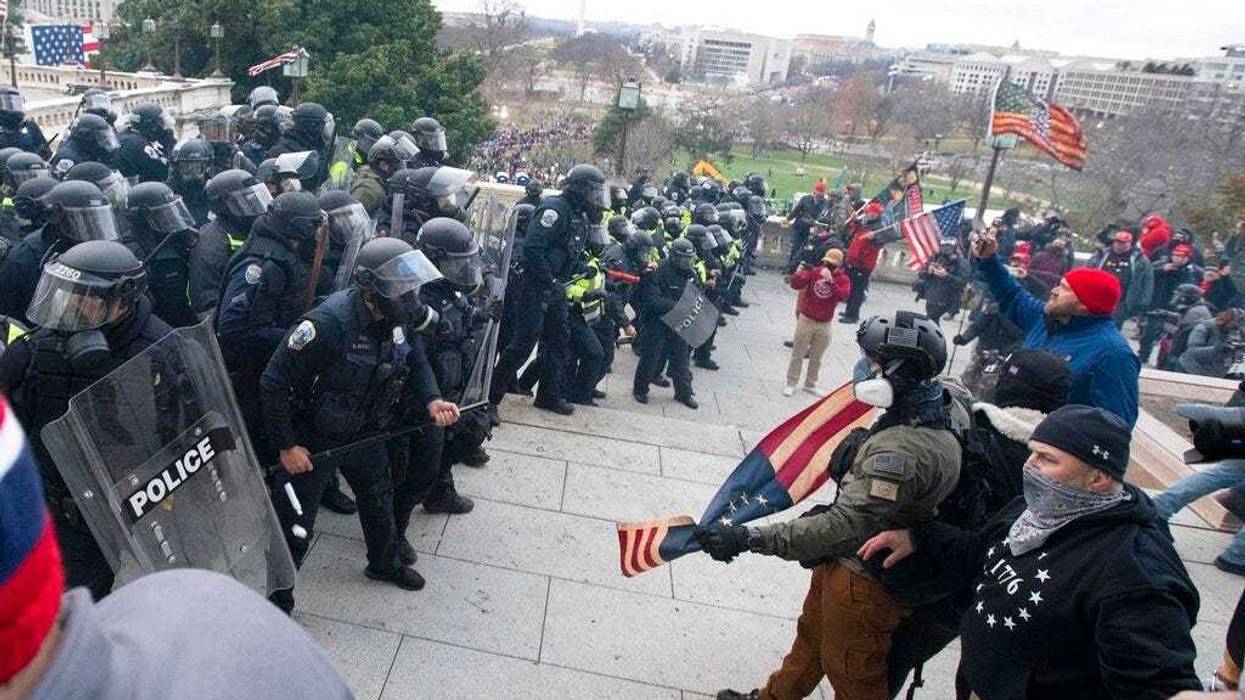 U.S. Capitol Police push back demonstrators who were trying to enter the U.S. Capitol on Wednesday, Jan. 6, 2021, in Washington.