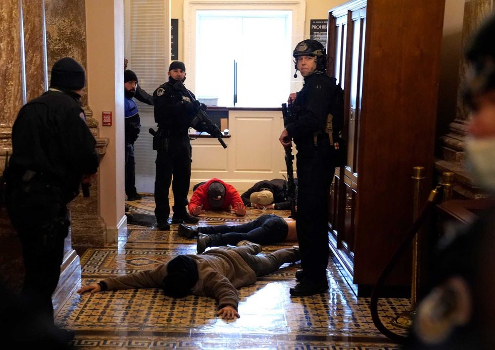 U.S. Capitol Police stand detain protesters outside of the House Chamber during a joint session of Congress on January 06, 2021 in Washington, DC. Congress held a joint session today to ratify President-elect Joe Biden