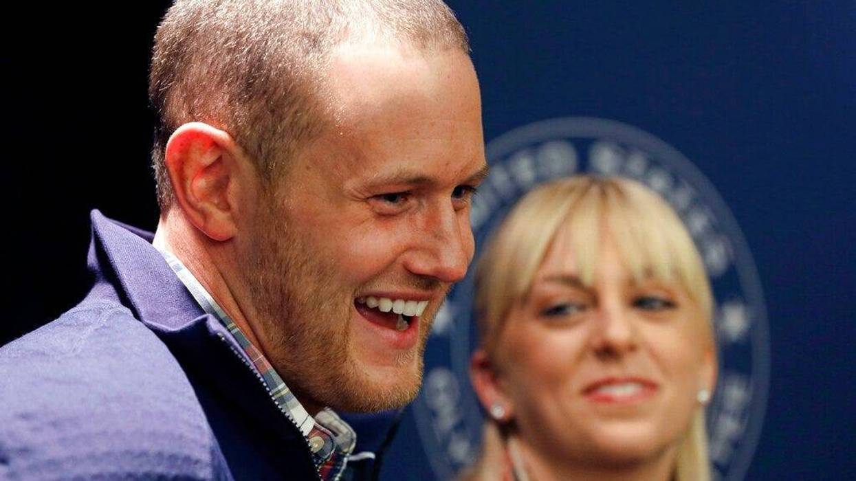 U.S. figure skating pairs Caydee Denney and John Coughlin speak with reporters during a news conference in Park City, Utah