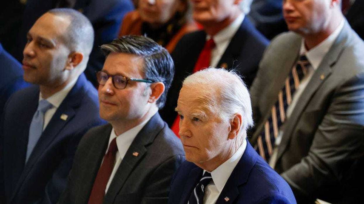 U.S. House Minority Leader Hakeem Jeffries (D-NY), U.S. Speaker of the House Mike Johnson (R-LA) and U.S. President Joe Biden listen during the annual National Prayer Breakfast in Statuary Hall in the U.S. Capitol on February 01, 2024 in Washington, DC. This is the first year the event is being hosted by the National Prayer Breakfast Foundation inside the Capitol after being controlled for decades by the Christian evangelical group the Fellowship Foundation.
