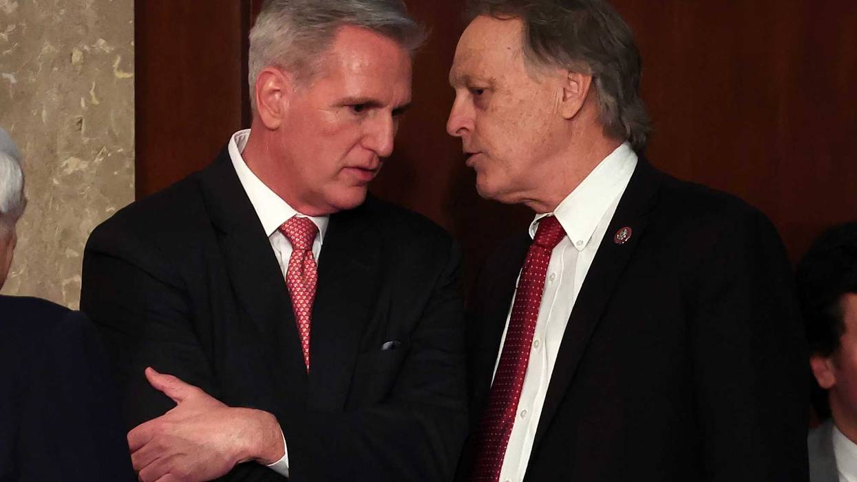 U.S. House Republican Leader Kevin McCarthy (R-CA) (L) talks to Rep.-elect Andy Biggs (R-AZ) in the House Chamber during the third day of elections for Speaker of the House at the U.S. Capitol Building on January 5, 2023 in Washington, D.C. The House of Representatives is meeting to vote for the next Speaker after House Republican Leader Kevin McCarthy (R-CA) failed to earn more than 218 votes on several ballots; the first time in 100 years that the Speaker was not elected on the first ballot.