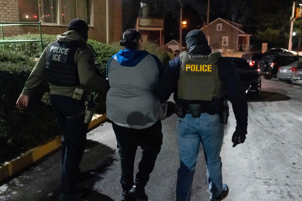 U.S. Immigration and Customs Enforcement officers detain a person, Monday, Jan. 27, 2025, in Silver Spring, Md