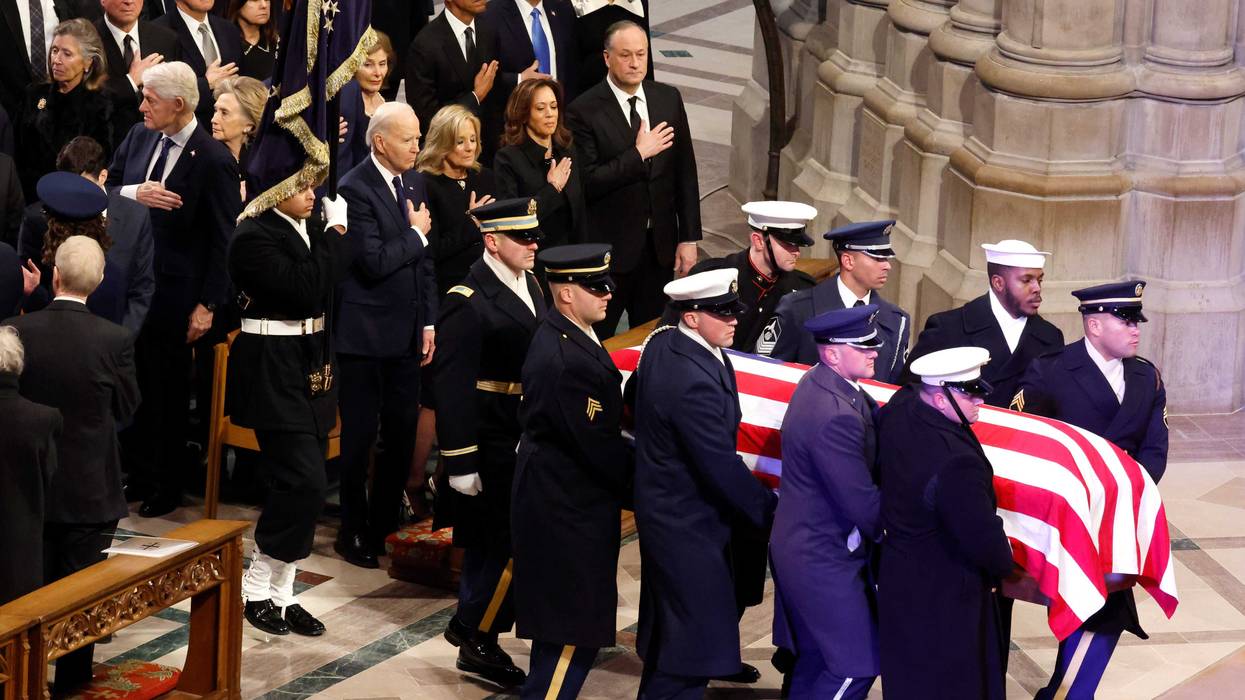 U.S. Military Body Bearers carry the flag-draped casket bearing the remains of former President Jimmy Carter into the Washington National Cathedral for his state funeral on January 9, 2025