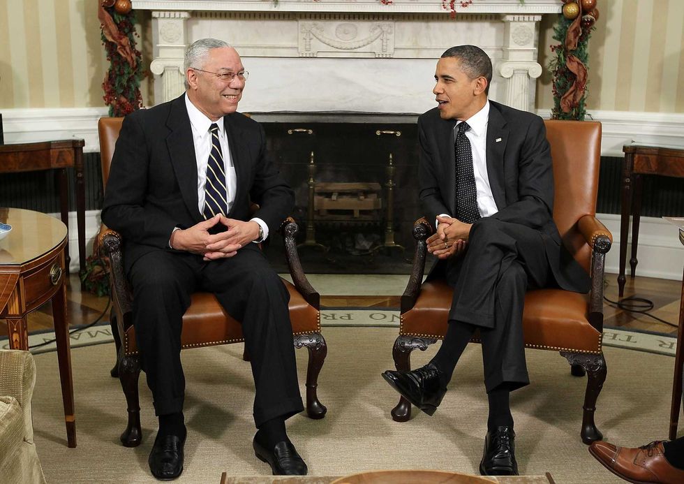 U.S. President Barack Obama (R) meets with former Secretary of State General Colin Powell (L) in the Oval Office of the White House December 1, 2010 in Washington, DC.