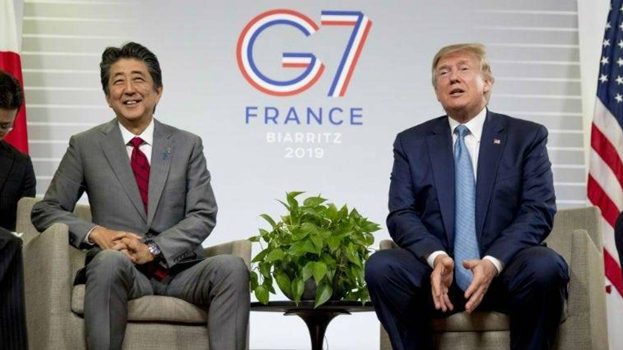 U.S President Donald Trump, accompanied by Japanese Prime Minister Shinzo Abe, left, speaks at a news conference at the G-7 summit in Biarritz, France, Sunday, Aug. 25, 2019, where they announced that the U.S. and Japan have agreed in principle on a new t
