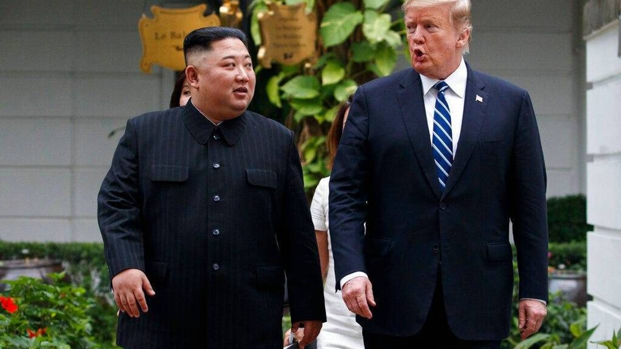 U.S. President Donald Trump and North Korean leader Kim Jong Un take a walk after their first meeting at the Sofitel Legend Metropole Hanoi hotel, Thursday, Feb. 28, 2019, in Hanoi
