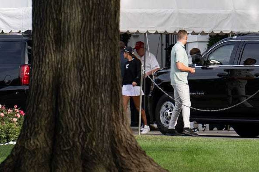 : U.S. President Donald Trump gets into his motorcade with his granddaughter Kai Trump before heading to Trump National Golf Club on August 30, 2025 in Washington, DC. Trump is spending his Labor Day weekend in Washington, DC after deploying the National Guard to Washington this month. (Photo by Kayla Bartkowski/Getty Images)