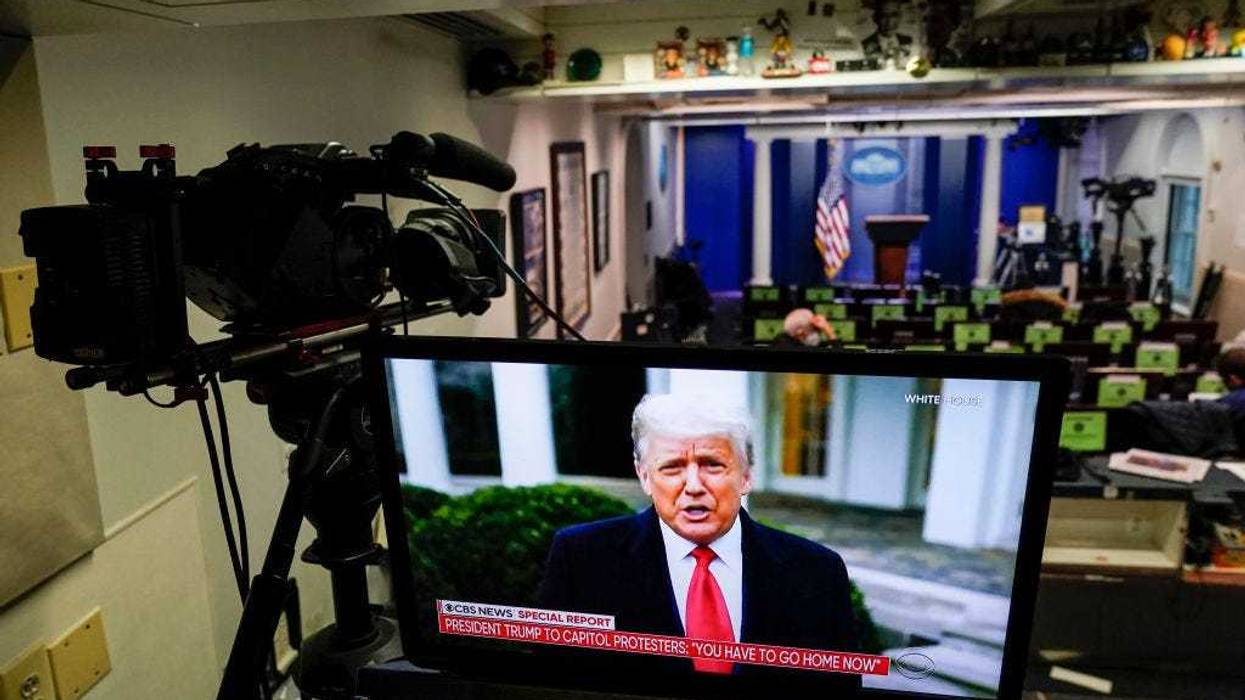 U.S. President Donald Trump is shown speaking on a monitor in the White House briefing room about the violence during the ratification of the 2020 election on January 6, 2021 in Washington, DC. Pro-Trump protesters have entered the U.S. Capitol building after mass demonstrations in the nation's capital. (Photo by Joshua Roberts/Getty Images)