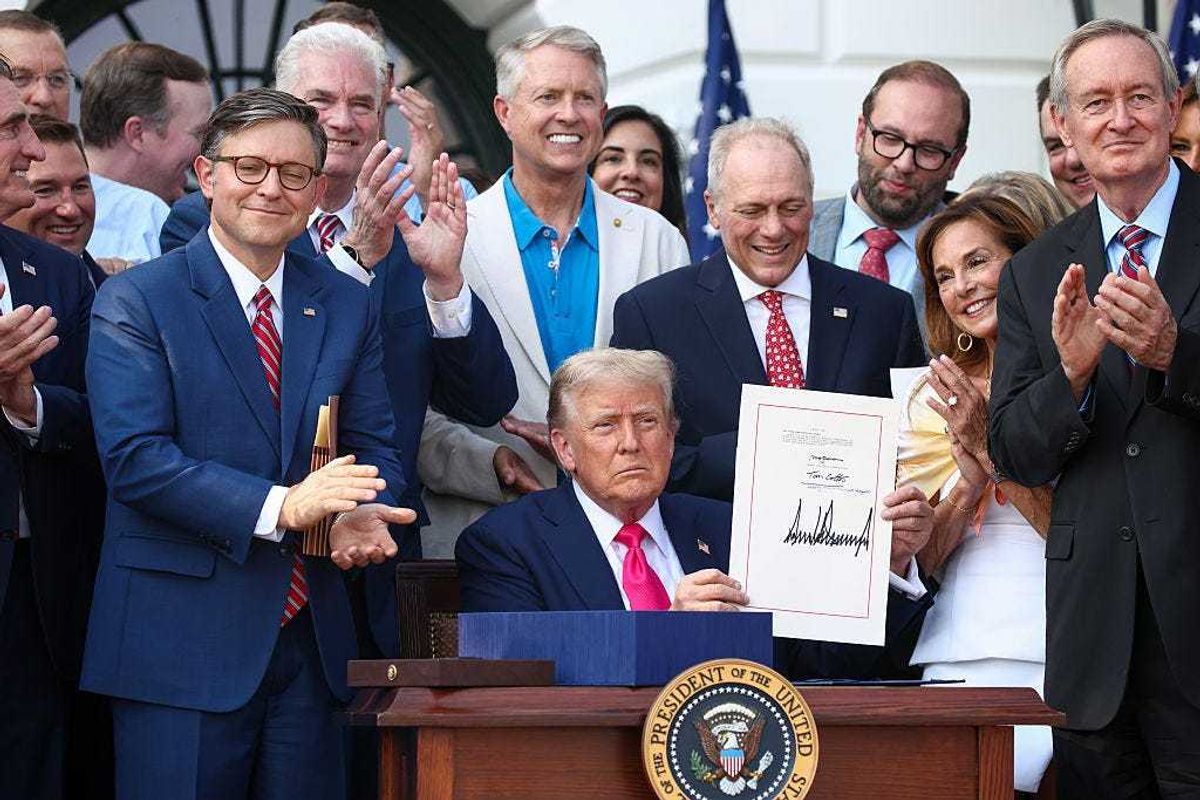 U.S. President Donald Trump, joined by Republican lawmakers, signs the One, Big Beautiful Bill Act into law during an Independence Day military family picnic on the South Lawn of the White House on July 04, 2025 in Washington, DC.