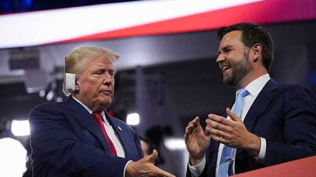 U.S. President Donald Trump (L) and Republican Vice Presidential candidate, U.S. Sen. J.D. Vance (R-OH) appear on the first day of the Republican National Convention at the Fiserv Forum on July 15, 2024 in Milwaukee, Wisconsin.