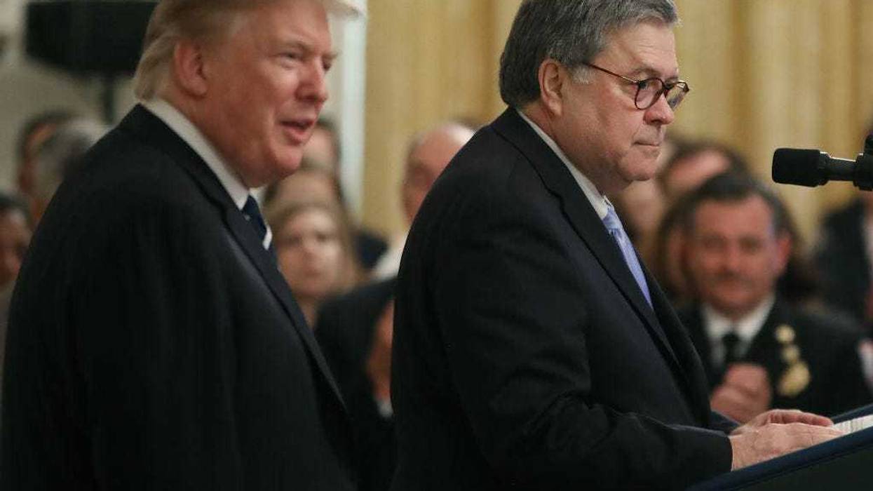 U.S. President Donald Trump (L) stands with Attorney General William Barr before the presentation of the Public Safety Officer Medals of Valor in the East Room of the White House May 22, 2019 in Washington, DC.