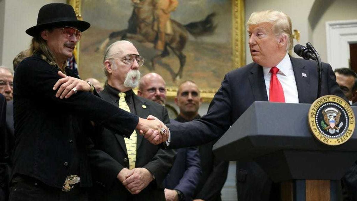 U.S. President Donald Trump shakes hands with Kid Rock prior signing a H.R. 1551, the 'Orrin G. Hatch-Bob Goodlatte Music Modernization Act' during a ceremony in the Roosevelt Room of the White House on October 11, 2018 in Washington, DC.