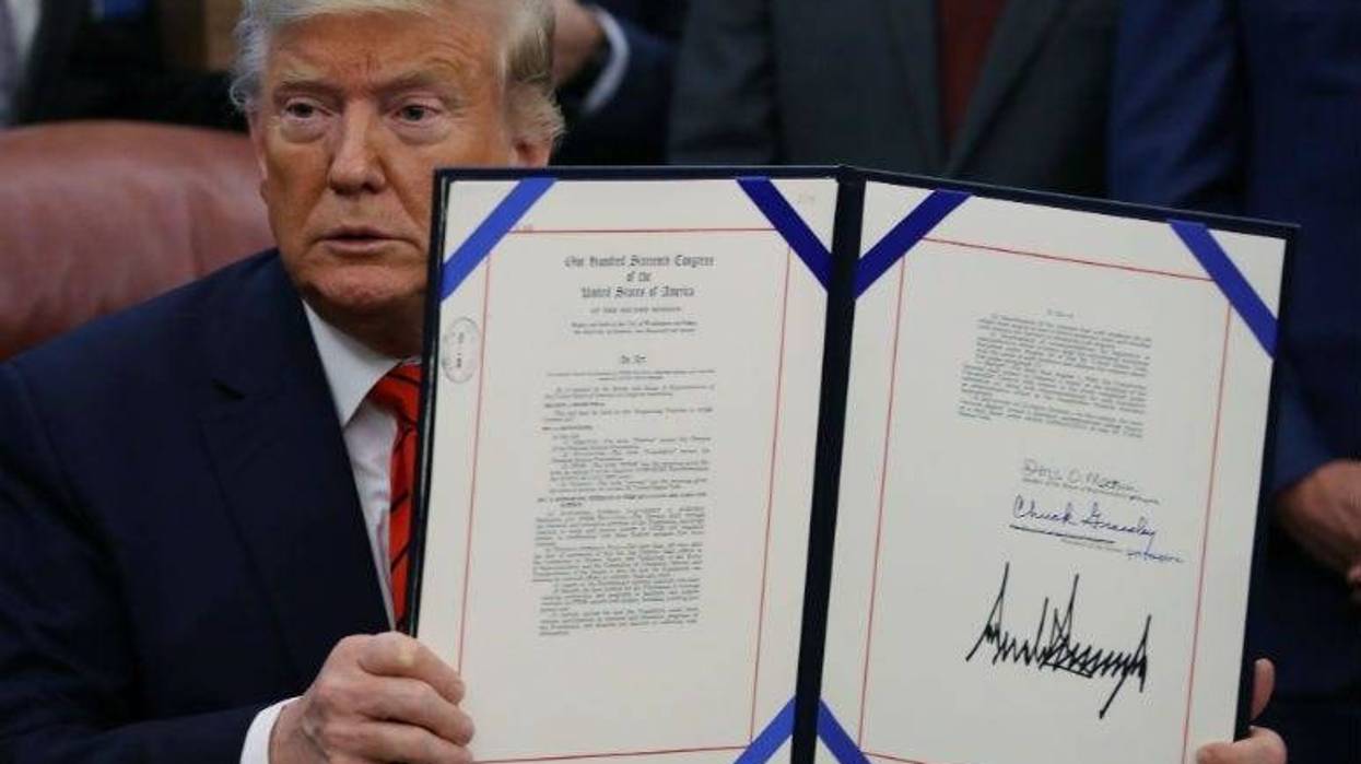 U.S. President Donald Trump signs the Supporting Veterans in STEM Careers Act, in the Oval office at the White House.