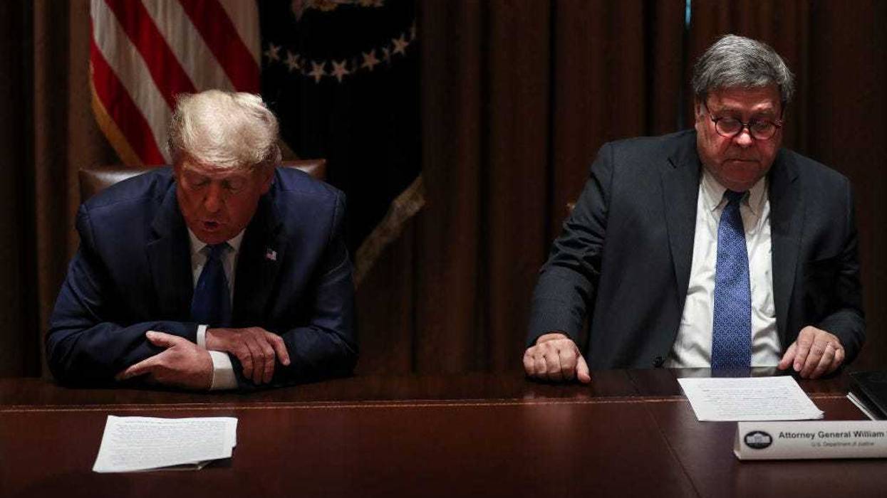 U.S. President Donald Trump speaks as U.S. Attorney General William Barr listens during a discussion with State Attorneys General on Protecting Consumers from Social Media Abuses in the Cabinet Room of the White House on September 23, 2020 in Washington, DC. (Photo by Oliver Contreras-Pool/Getty Images)