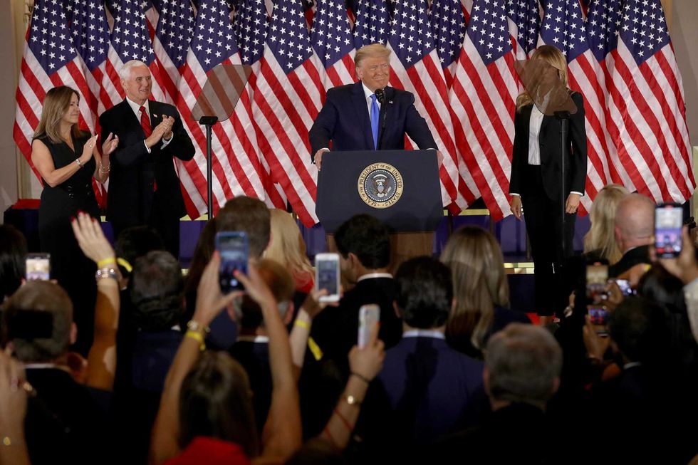 U.S. President Donald Trump speaks on election night in the East Room of the White House as First Lady Melania Trump, Vice President Mike Pence and Karen Pence look on in the early morning hours of November 04, 2020 in Washington, DC.